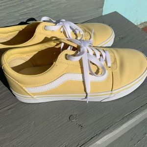 Woman’s yellow Vans